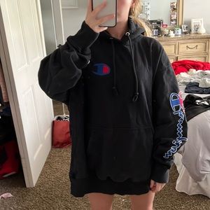 Champion Sweatshirt with red and blue champion writing on the sleeve